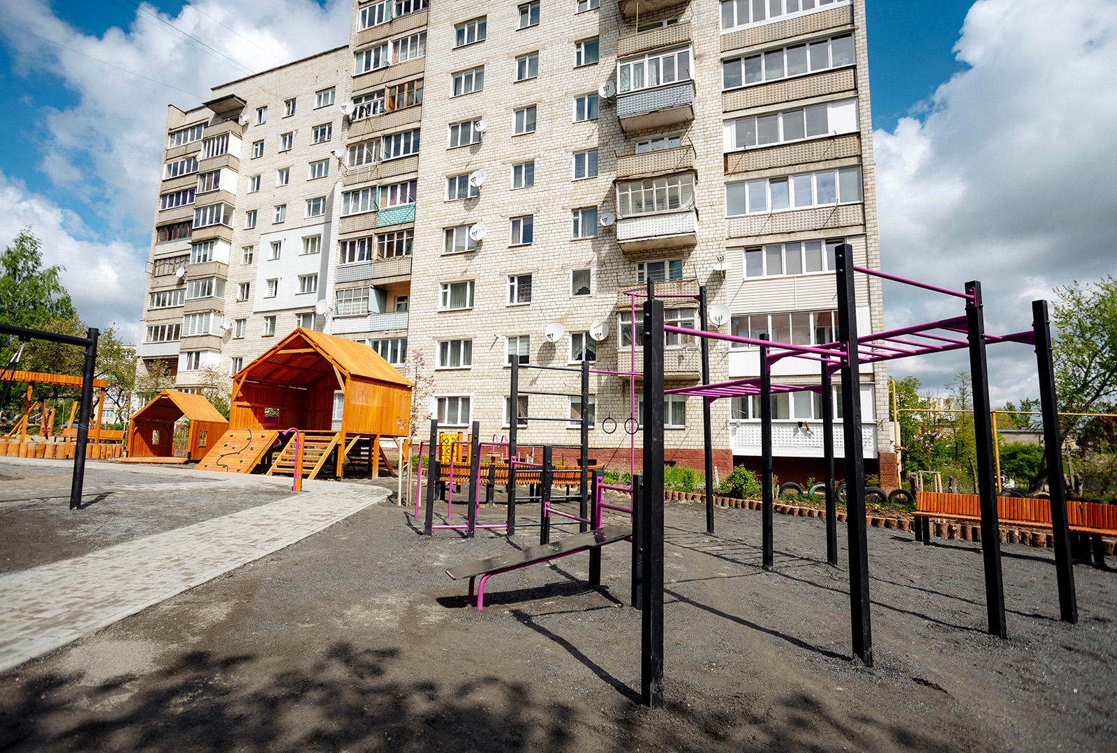 An overview photo that shows a new playground build for internally displaced people in Ukraine. This includes, monkey bars, and another play structure.