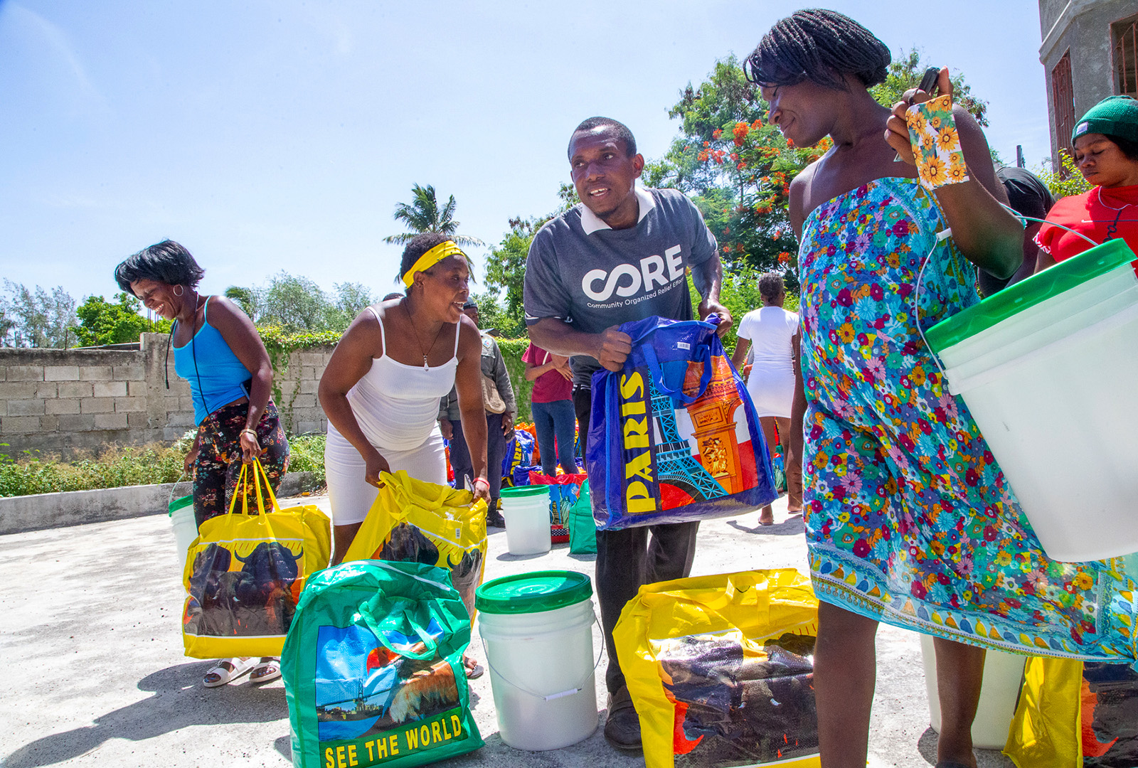 CORE team distributing food kits containing locally sourced, nutrient dense food, providing enough meals for a family of five for over a month.