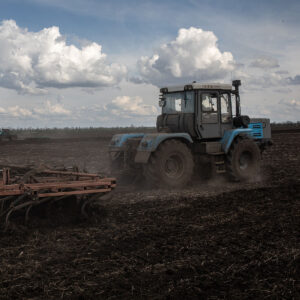 tractor drives over a field in Ukraine