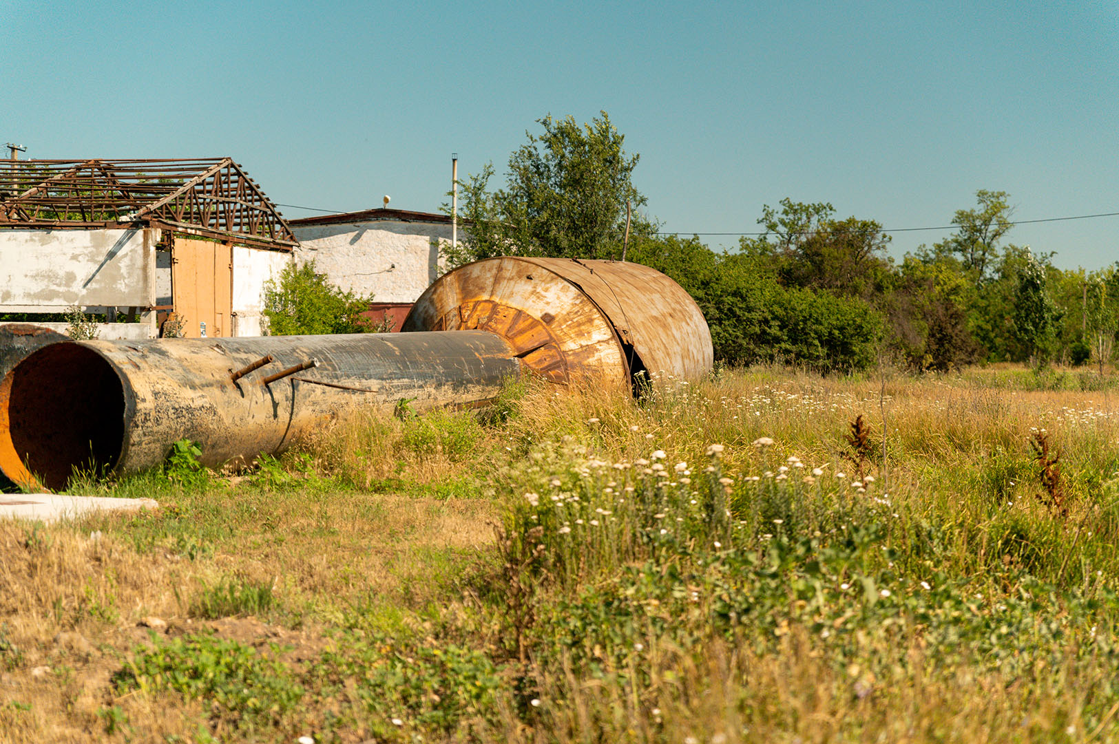 broke water tower laying in field in kobzartsi, mykolaiv