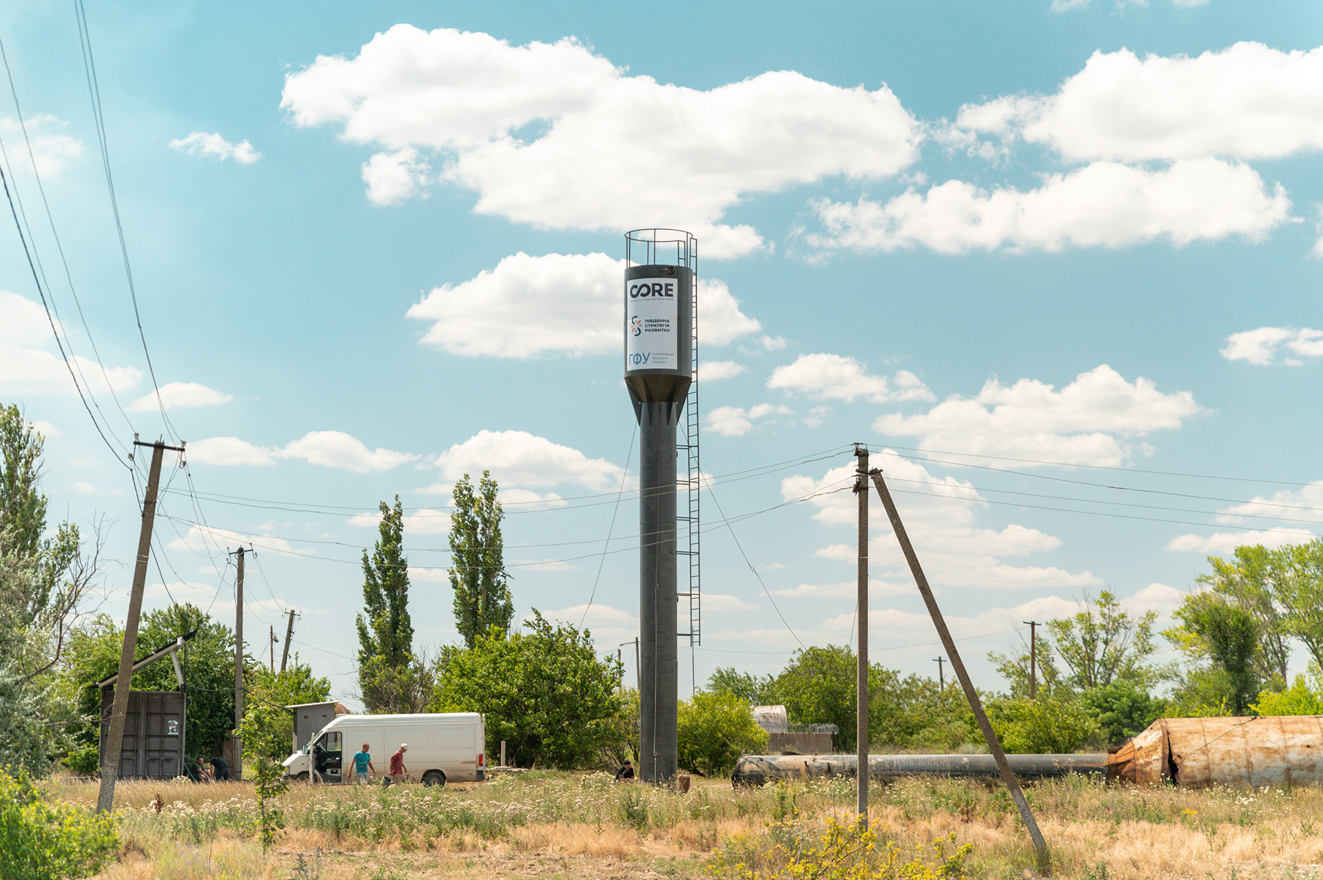 Water tower built in a field with trees - Ukraine