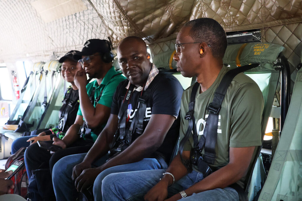 Garry, a Haiti staff member sits in helicopter in Haiti