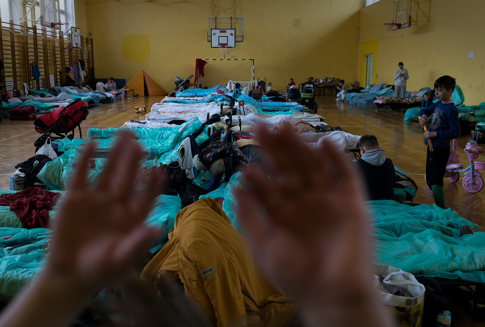 A primary school gymnasium in Przemysl, Poland, converted into a temporary shelter for refugees that hosted mainly women and children.