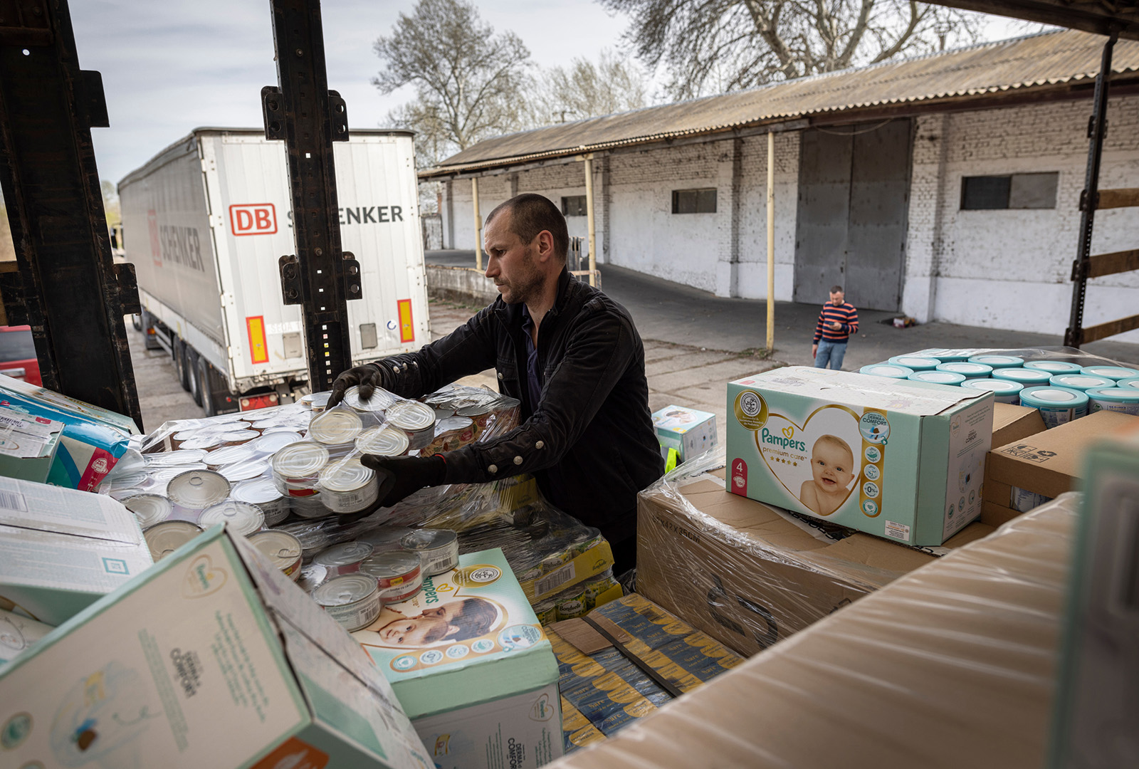 A load of supplies from CORE that has just crossed the border from Romania being repacked into another truck heading to Mykolaiv, Ukraine.