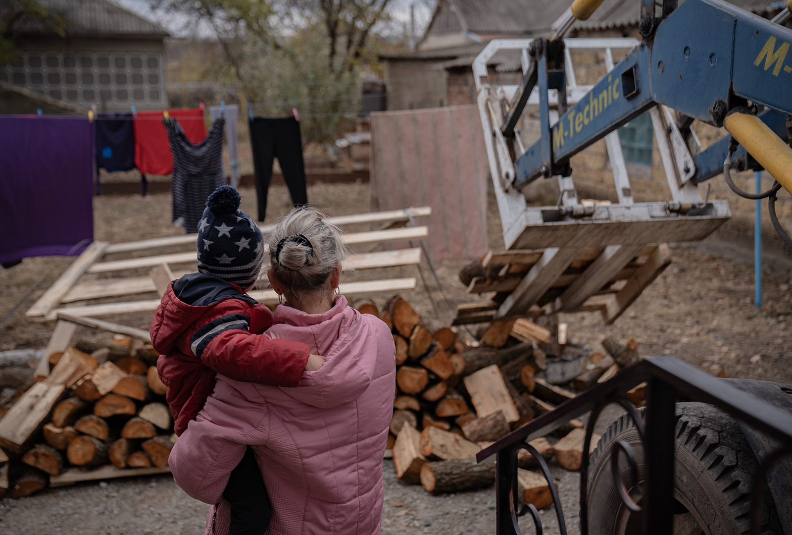 Firewood is delivered to the Sydorenko family at their home in a village near the front line in Zaporizhzhia Oblast in November 2024.