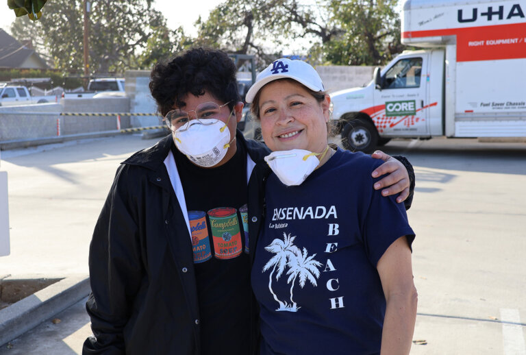 Two volunteers pose for a photo at a CORE event in response to the Los Angeles fires.