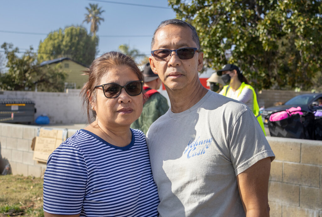 Woman and man pose for camera at ditro event