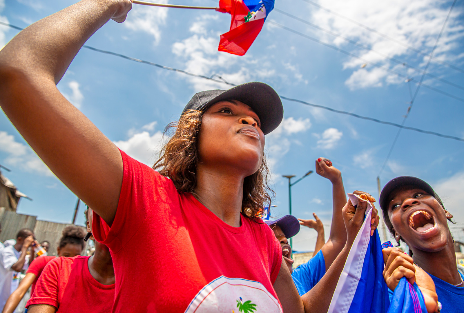 Students from Delmas 32 Schools march in a Flag Day Parade on May 18, 2019.   CORE works closely with a network of 28 schools throughout Delmas to provide training, foster the sharing of educational resources, and put on community events.