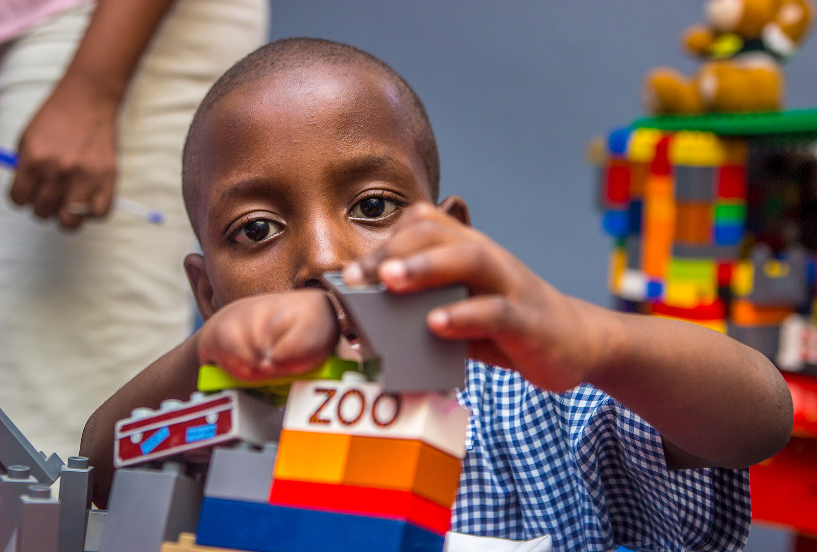 A student in the pilot special needs class at J/P HRO’s Ecole Soleil d’Espoir, known today as the School of Hope and Sunshine, plays in November 2014. Ecole Soleil d’Espoir started in the Petionville Club Camp, and as its students returned to the community so did the school. 2014 saw the start of the special needs pilot program, which lead to full special-needs integration across all classrooms. In 2017, the office of Haiti’s Secretary of State for the Integration of Handicapped Persons presented J/P HRO with the Accessibility Prize for contributions to the process of inclusion for handicapped persons in Haiti.